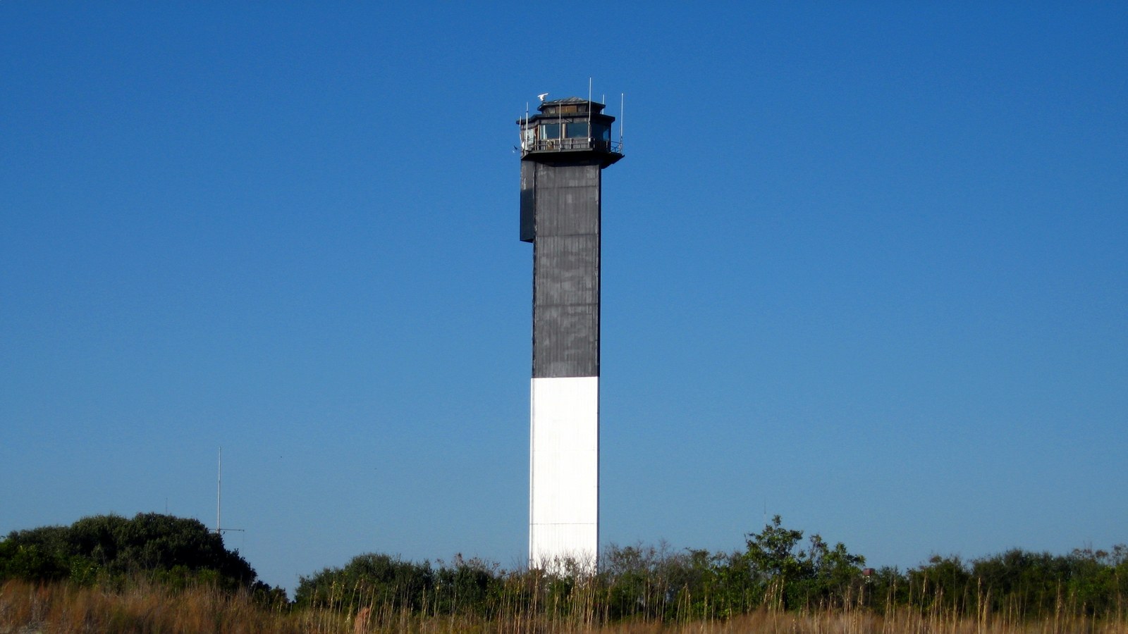 Sullivan's Island Light, the black-and-white striped lighthouse standing above the dunes