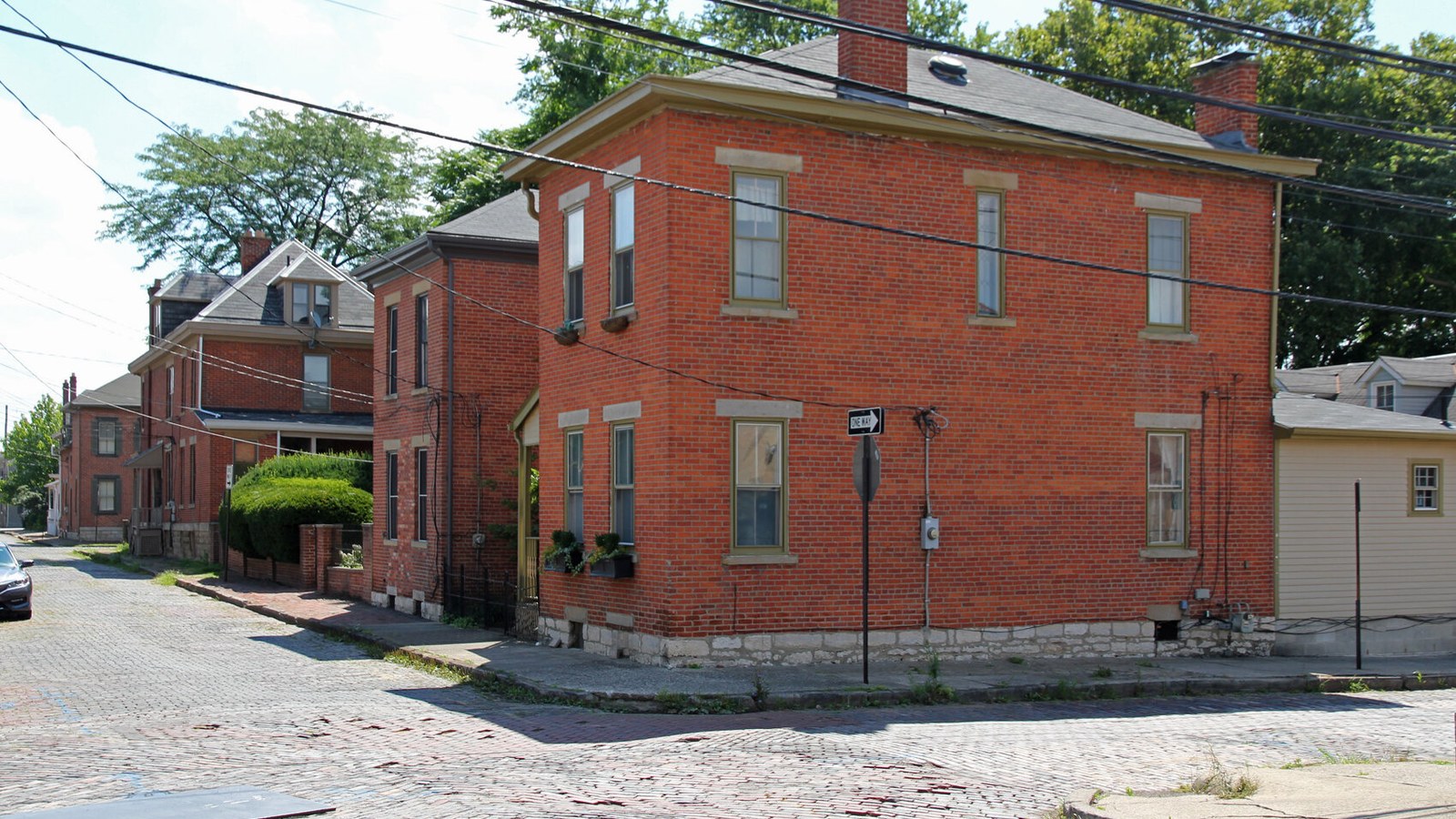 Brick houses on a tree-lined street in Columbus's German Village neighborhood