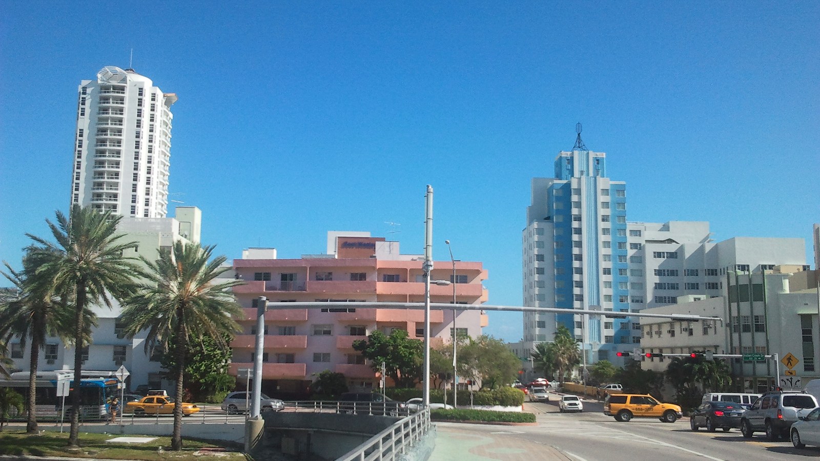 A bridge over Indian Creek at 41st Street leading toward Mid-Beach's high-rise condo towers and Art Deco hotels