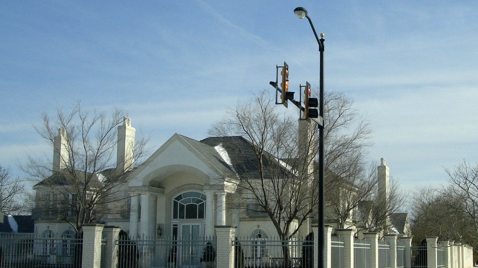 A stately brick home along a tree-lined street in Nichols Hills, one of the Oklahoma City area's most affluent enclaves