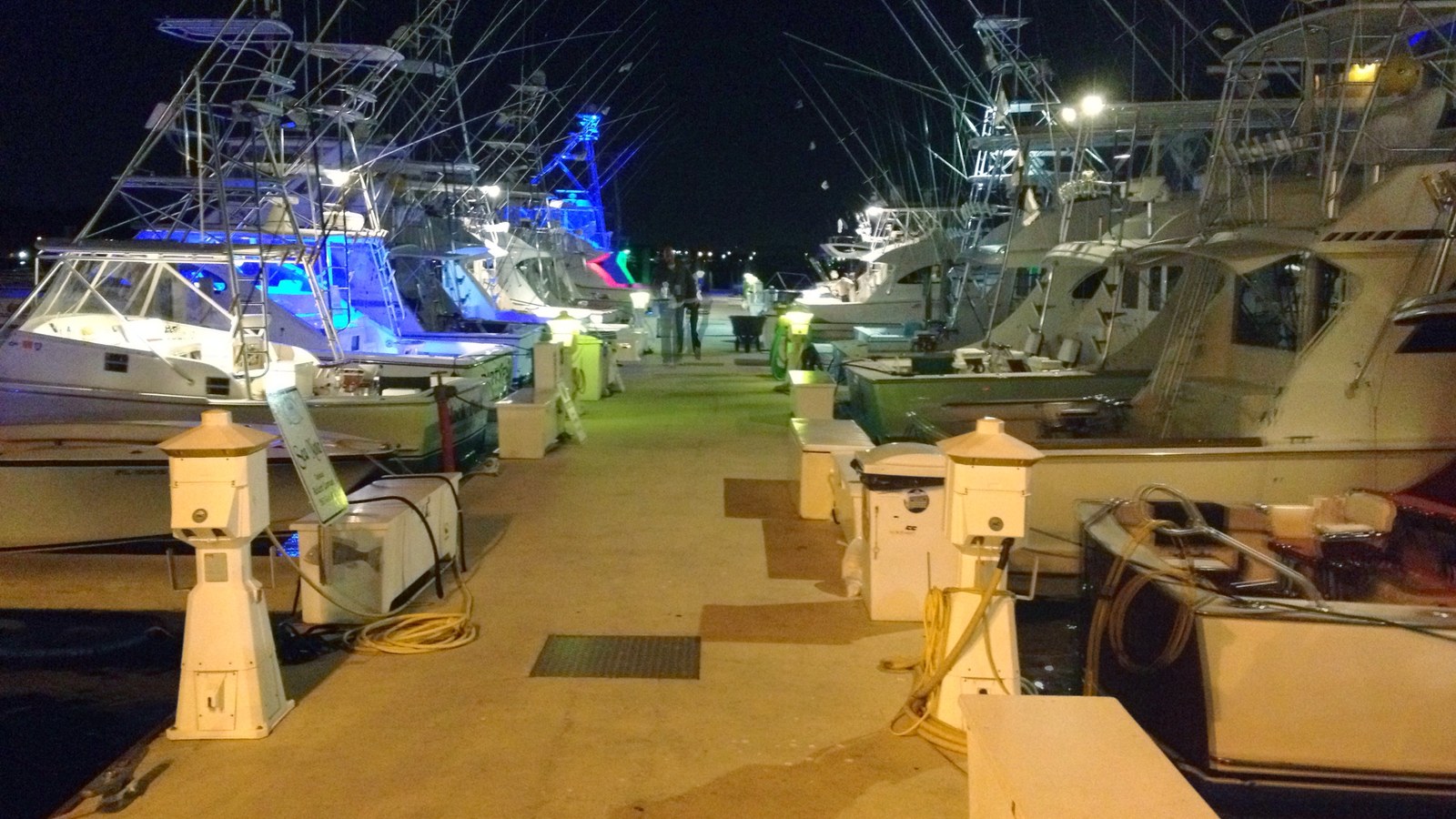 Charter fishing boats docked at the Sailfish Marina on Singer Island in Riviera Beach at night