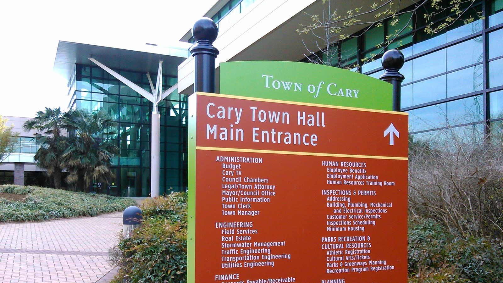 Cary Town Hall main entrance sign in front of the modern municipal building