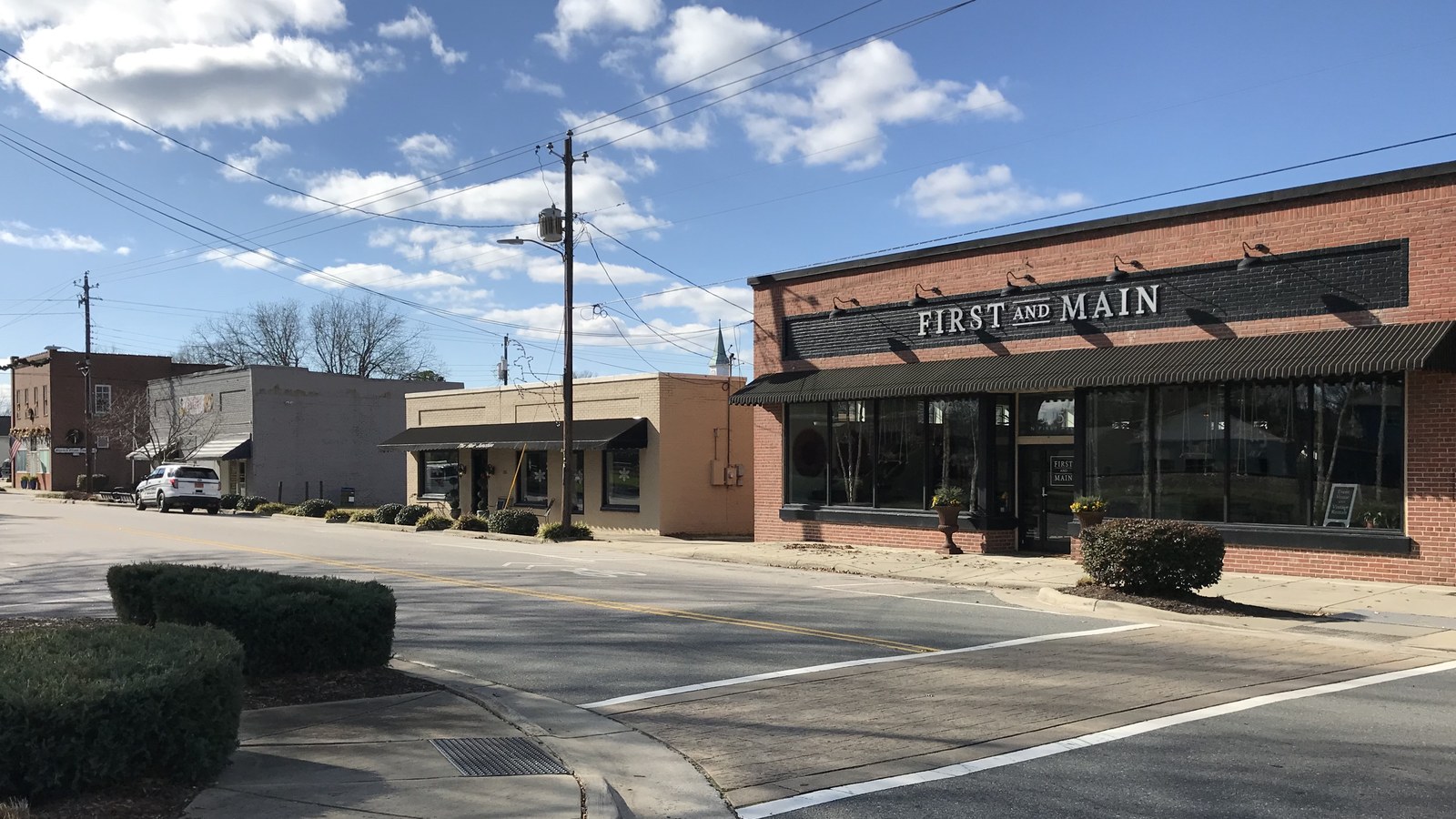 The First and Main building in historic downtown Knightdale under a clear blue sky