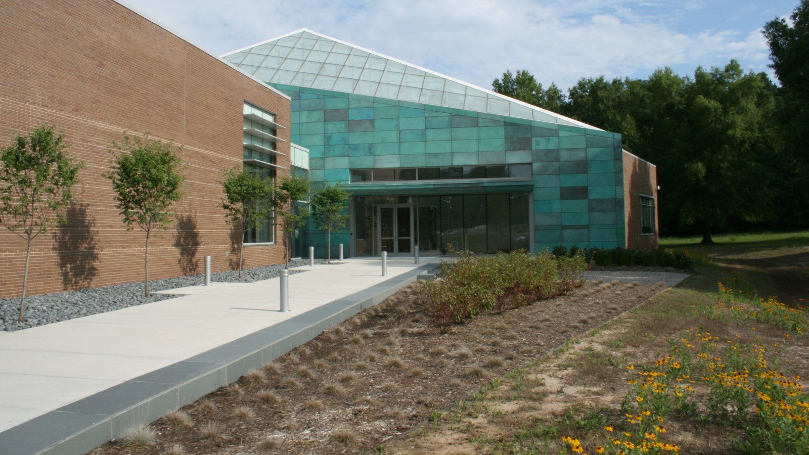 The Research Triangle Park headquarters building, with a distinctive glass and copper-panel entrance