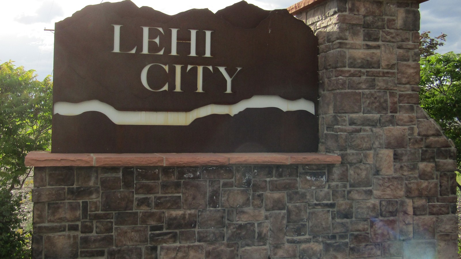 A stone monument sign reading 