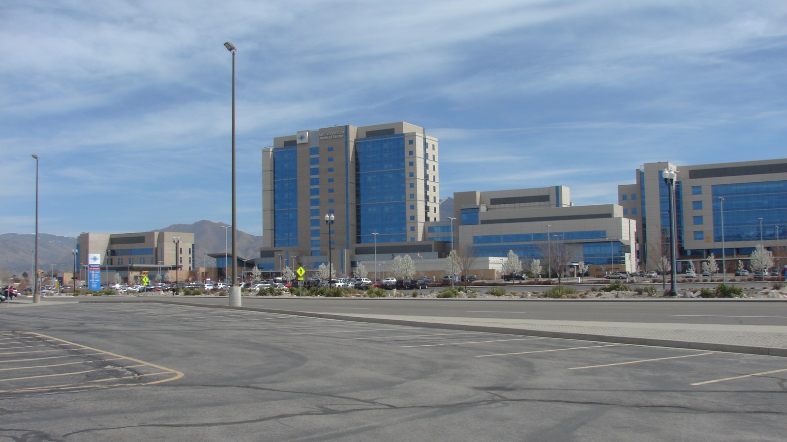 Intermountain Medical Center's high-rise tower and medical campus in Murray, Utah, seen from across State Street near Murray Central Station